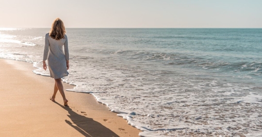 Woman walking on beach