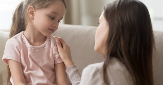 Mother consoling child