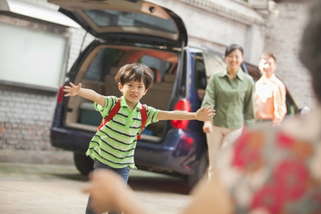 Child running to hug the parent