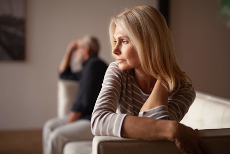 woman sitting away from spouse